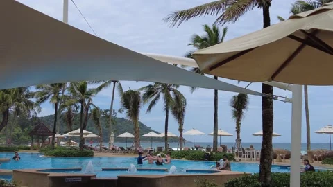 Tourists have fun dancing on water aerobics in the hotel pool Stockbeeldmateriaal 219763561