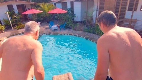 Tourists having fun jumping in a pool of a lodge in the ecuadorian amazon top Stock-Footage 116207240
