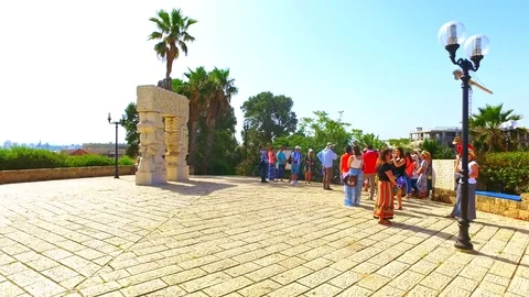 Tourists by Iconic installation on beach of Tel Aviv by Mediterranean sea Stock Footage 73607392