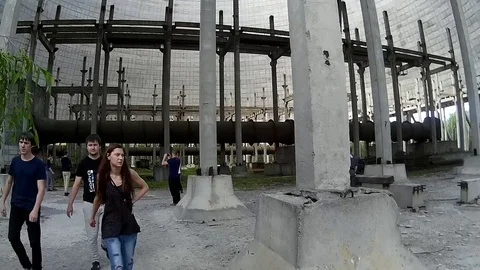 Tourists inside of cooling tower of nuclear reactor Stock Footage 76938438
