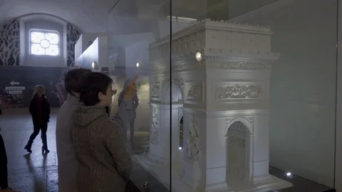 Tourists inside looking at Arc de Triomphe model interior monument Paris France Stock Footage 93815316