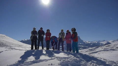 Tourists in joy throw snow Stock Footage 87694978