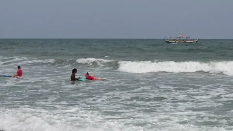 Tourists learning to surf Atlantic Ocean waves, Kokrobite Beach, Ghana Video stock 293238202