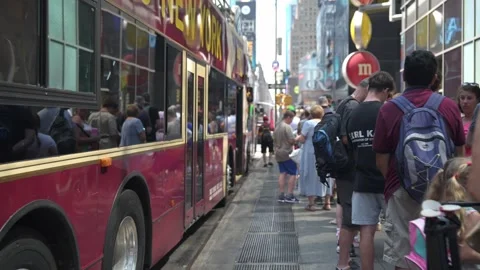 Tourists Lining Up for a Big Bus Tour in Times Square, New York City. Stock Footage 295885818