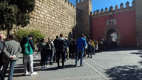 Tourists in long Queue Real Alcazar de Sevilla Palace Museum Seville Andalucia Stock Footage 102951867