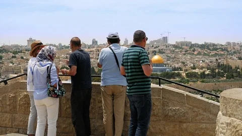 Tourists look at the Jerusalem Old City view Stock Footage