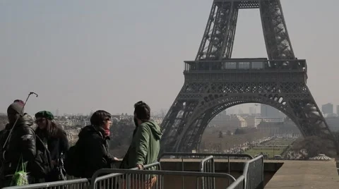 Tourists look over The Eiffel Tower (Tour Eiffel) - Paris, France Stock Footage 61237498