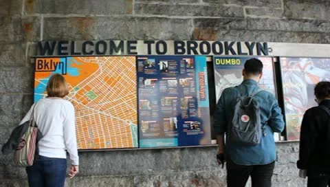 Tourists Looking at Brooklyn Bridge Map Stock Video Stock Footage 9347653