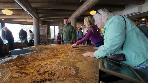 Tourists Looking at Geological Relief Map of The Grand Canyon Stock Footage 238889101