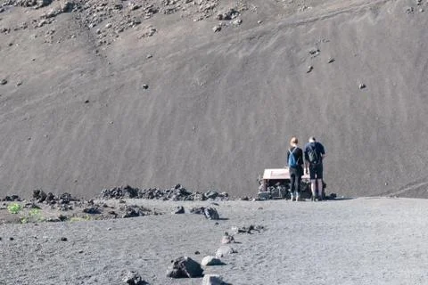 Tourists looking at informationa table under Caldera de los Cuervos, Timanfay Stock Photos