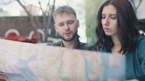 Tourists looking in the map Stock Footage 74522189
