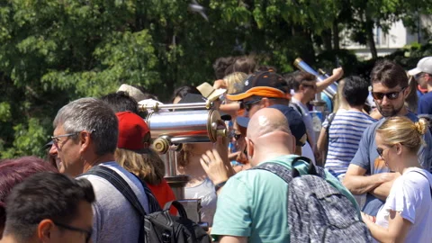 Tourists looking at the rooftops of paris from the Sacre Coeur in Montmartre Stock Footage 134259262