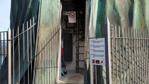 Tourists on main stairs of big statue of san carlo in arona, italy Stock Footage 276704053