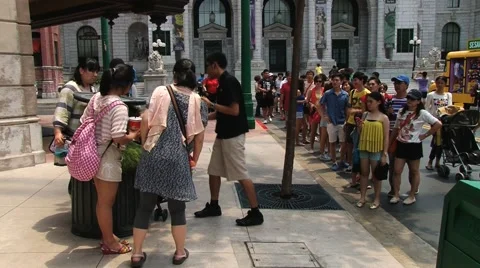 Tourists make photo at the Universal studio park at Sentosa island, Singapore. Stock Footage 62073343