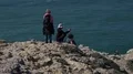 Tourists making photos and selfies at rocky cliffs and coastline of Portugal 4k or 4k+ Resolution