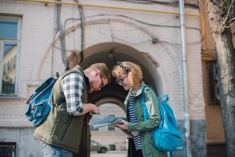 Tourists with a map on the background of the city Stock Photos