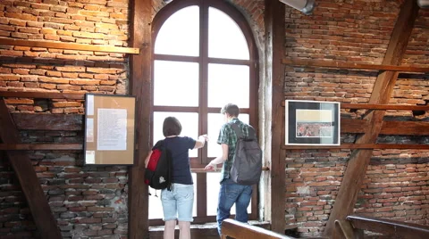 Tourists in museum looking out the window, directions, town map, art exhibition Stock Footage 40687373