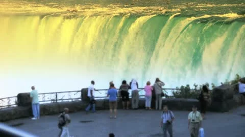 Tourists at Niagara Falls at Sunrise Sunset Stock Footage