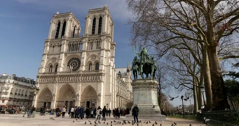 Tourists Notre-Dame de Paris. It is a medieval Catholic cathedral Paris, France Stock Footage 87967573
