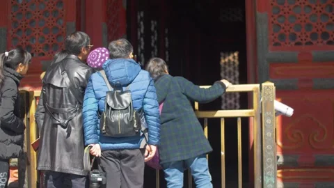 Tourists Observing Interior Through Gate at Forbidden City Entrance in Beijing Stock Footage 345831917