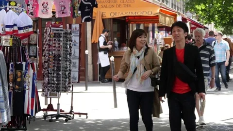 Tourists people walking in beautiful Paris city center Stock Footage