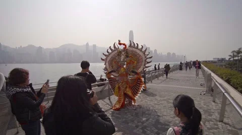 Tourists photographing a costumed character on the boat quay. FullHD video Видео 59882126