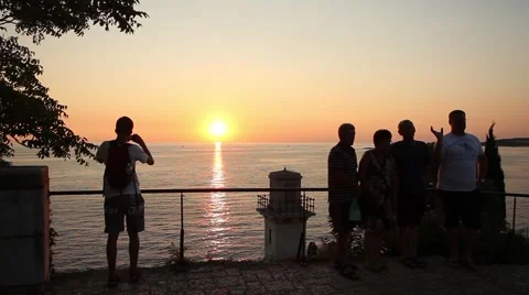 Tourists photographing sunset Stock Footage 51786464