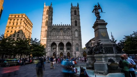 Tourists at Place d'Armes square in front of Notre-Dame Basilica of Montreal Stock Footage 119131102