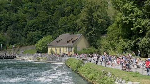 Tourists on the promenade in front of the Rhine Falls in Neuhausen Stock Footage 123711435