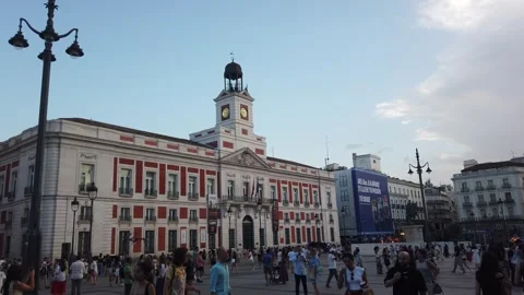 Tourists in Puerta del Sol Square Past Real Casa de Correos Clock Tower Madrid Stock Footage 339751383