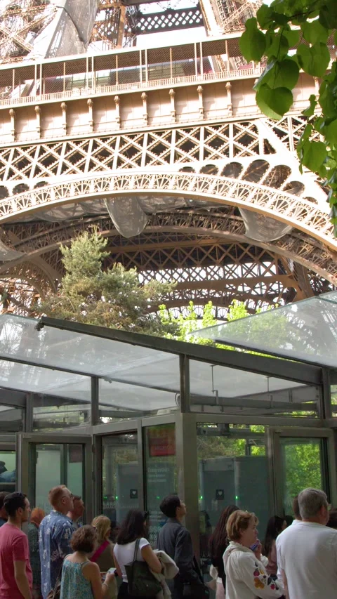 Tourists Queue at the Eiffel Tower Security Entrance on a Summer Day Video stock 335194768