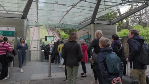 Tourists in a queue to funicular at Montmartre in spring, Paris, France - 4K Stock Footage 262146502