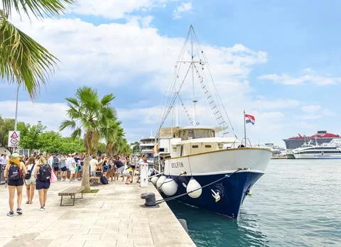 Tourists queue for ships in the city of Split, Croatia. Stock Photos