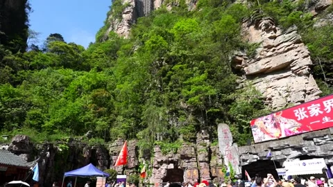 Tourists queueing at the Bailong elevator in Zhangjiajie, China Stock Footage 341658376