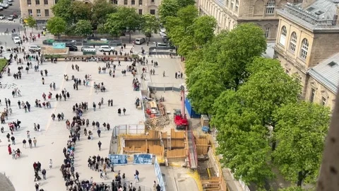 Tourists queueing in a busy square in Paris, France Stock Footage 337532683