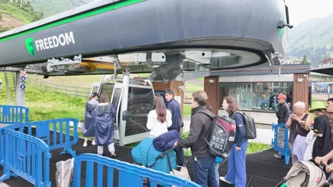 Tourists queueing at Freedom cable car station in Shymbulak mountain resort Stock Footage 345447551