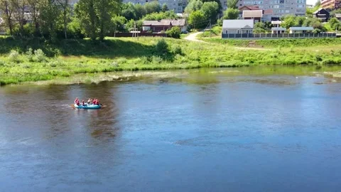 Tourists raft down the river in an inflatable boat Stock Footage 213041897