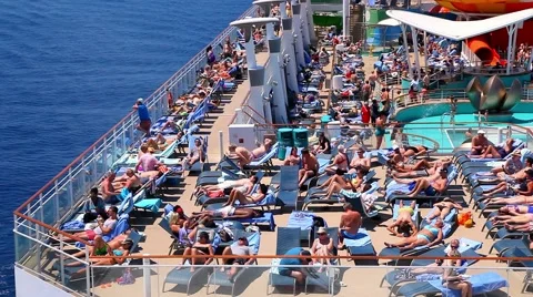Tourists Relax On The Deck Of The Caribbean Cruise Ship During Summer Vacation Stock Footage