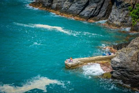 Tourists relaxing on the cliffs Stock Photos