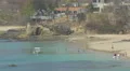 Tourists relaxing with a dog on the beach in Panama 4k or 4k+ Resolution