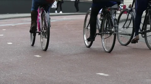 Tourists ridind bycycle Amsterdam Stock Footage 72266442