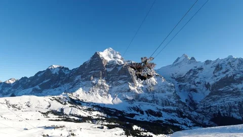 Tourists riding on giant eagle down the zipline from Grindelwald First Video stock 134288430