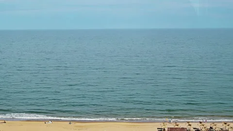 Tourists on the Seaside Beach in Summer Stock Footage 309154012