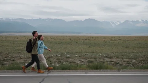 Tourists on the side of the road in the mountains. Stock Footage 280726097