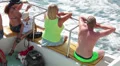 Tourists sitting on deck of recreational marine boat HD Footage