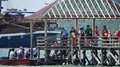 Tourists in small boat on sea arrive wooden landing stage in Asia 4k or 4k+ Resolution