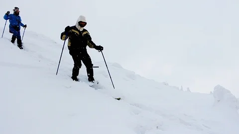 Tourists in the snow Stock Footage 99906811
