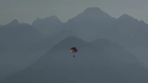 Tourists soaring high above the sea while parasailing Fotos de archivo