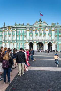 Tourists stand in queue long hours in the State Hermitage Museum, St. Petersb Stock Photos