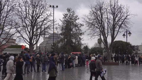 Tourists standing in queue in city center Stock Footage 267060704
